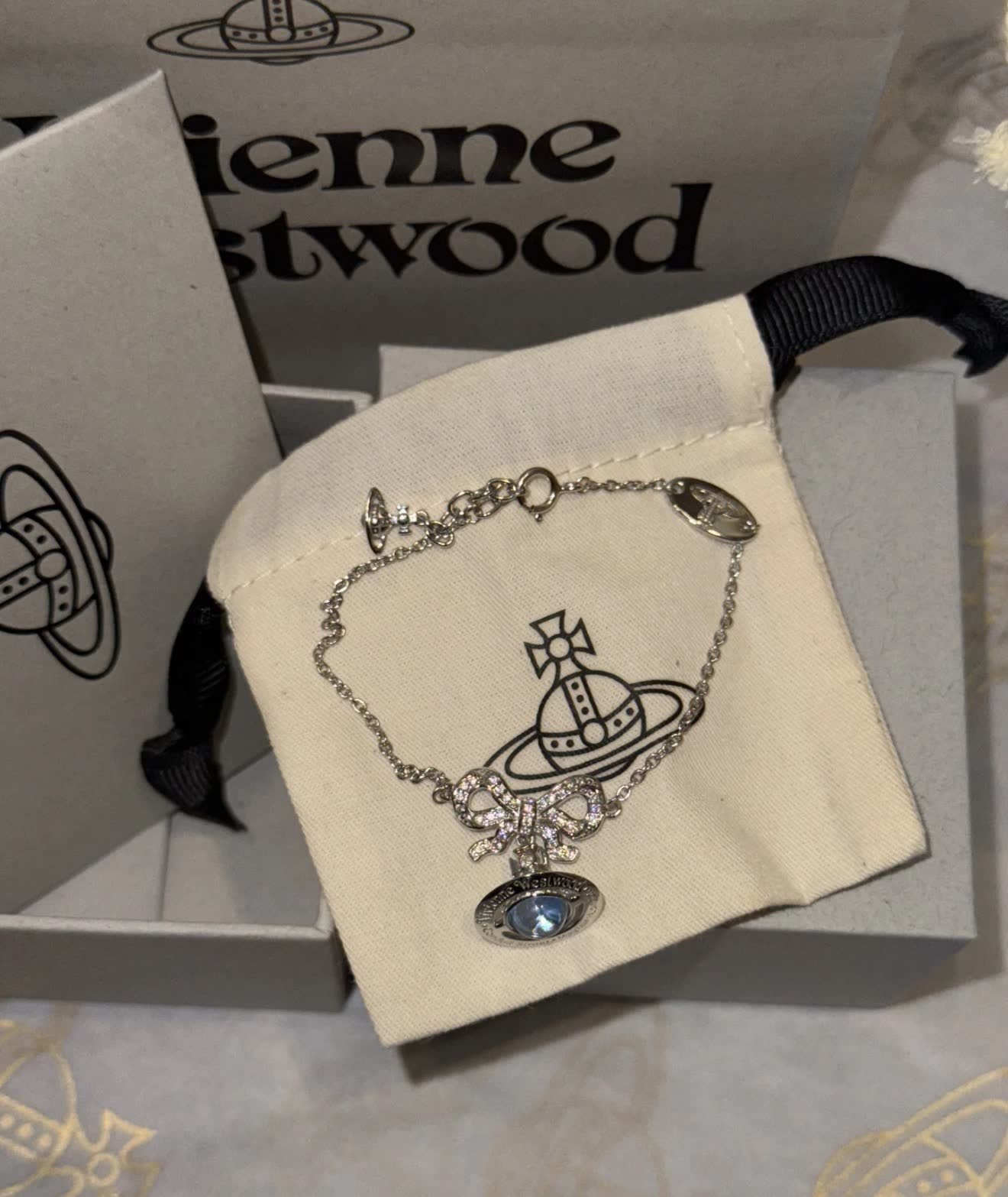 Vivienne Westwood Silver Bracelet with Blue Stone and Bow